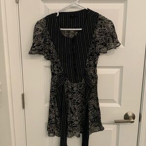 Flutter sleeve top.  Sheer with black pin strip sash. Size 0.